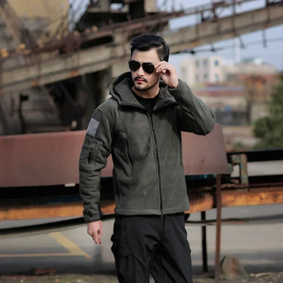 Warm tactical winter fleece jacket for men with adjustable hood and multiple pockets.