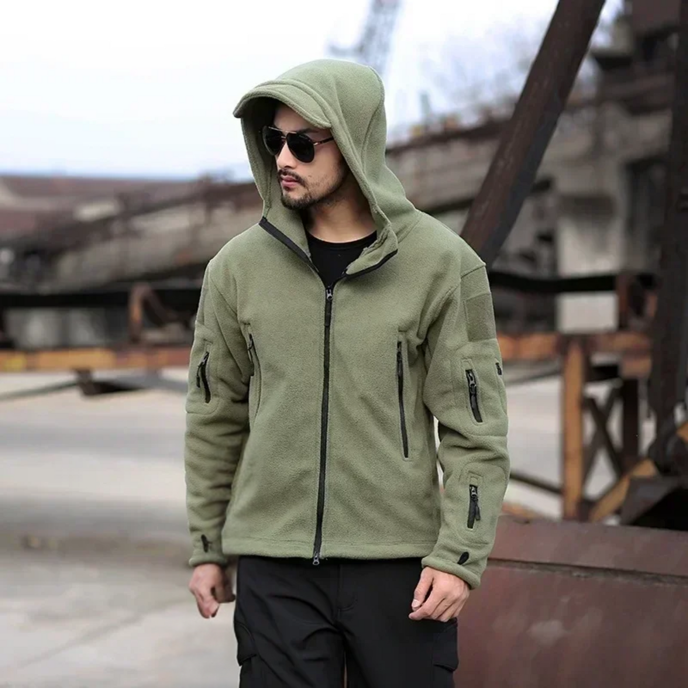 Warm tactical winter fleece jacket for men with adjustable hood and multiple pockets.